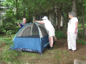 Perry, Jerri and Sulie set up Perry's new tent, which she will sleep in for the first -- and last -- time.  Everyone else gets a bed in the cottage or sleeping cabin